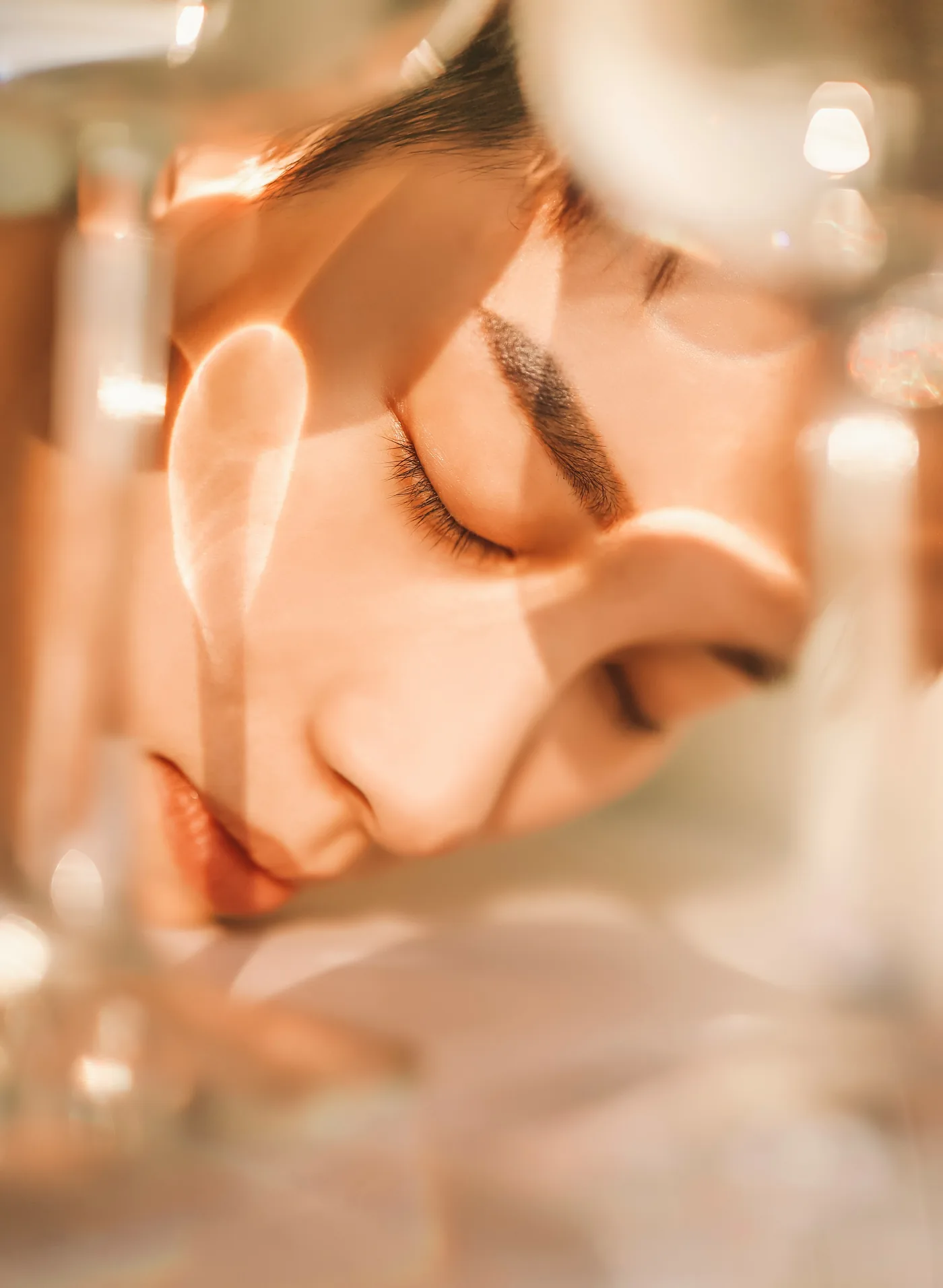 Softly lit portrait seen through reflective glass