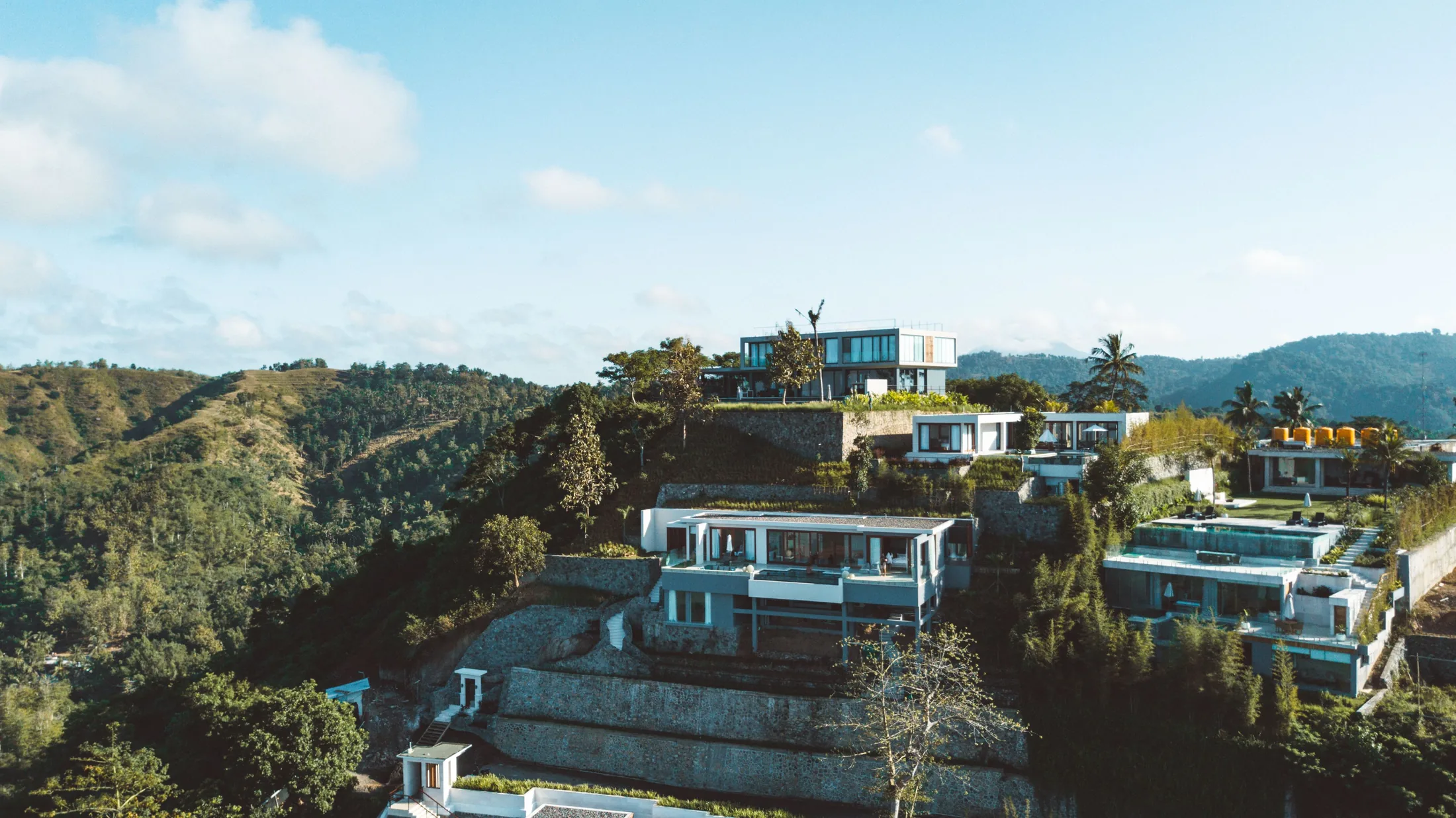 A hillside retreat surrounded by green mountains