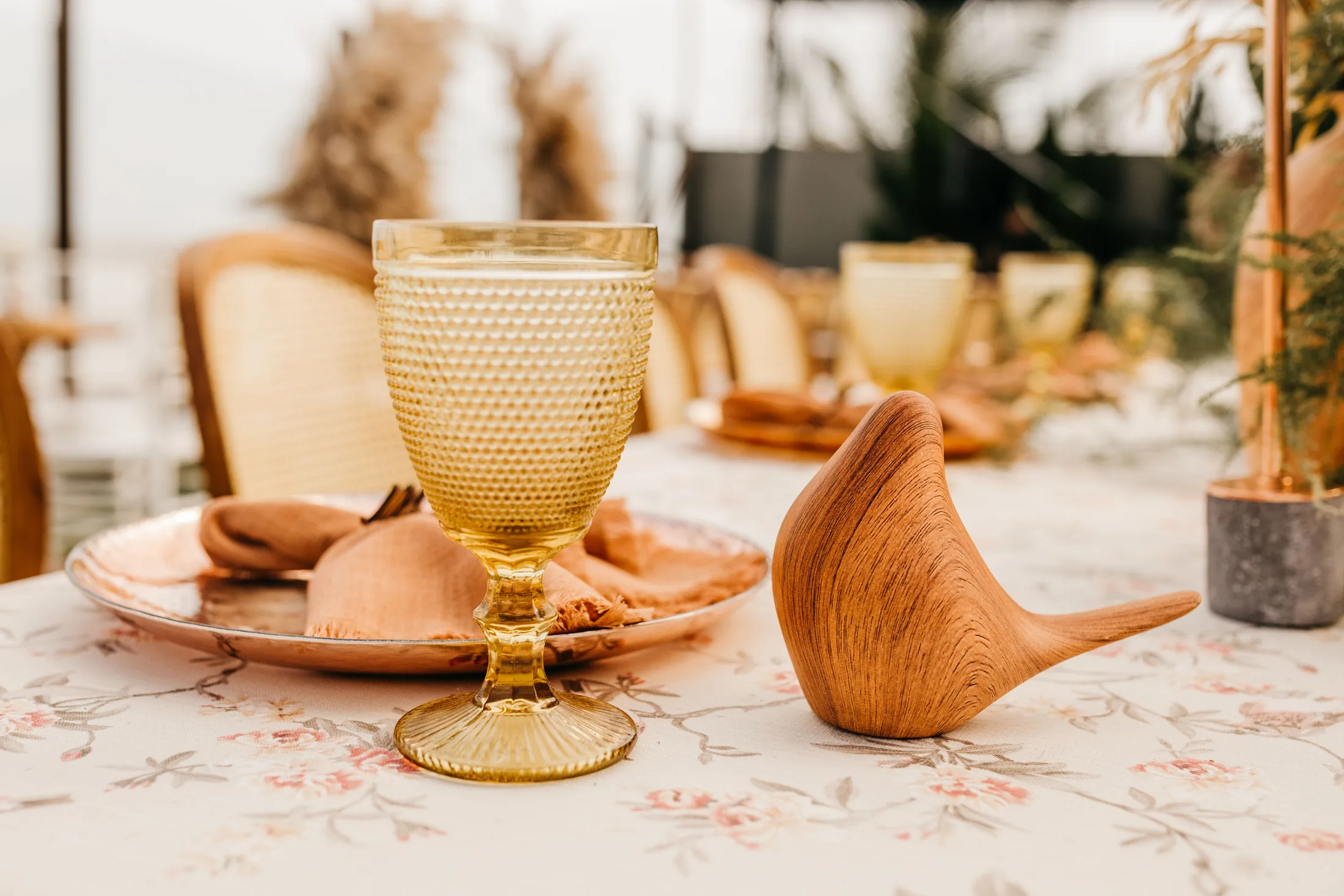 An elegant neutral table setting in warm daylight