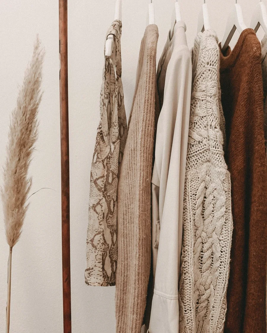 Natural linen and cotton layers on a clothing rail