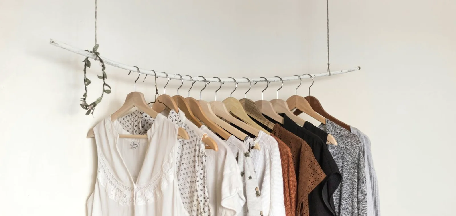 A soft rail of neutral garments ready for repeat wear