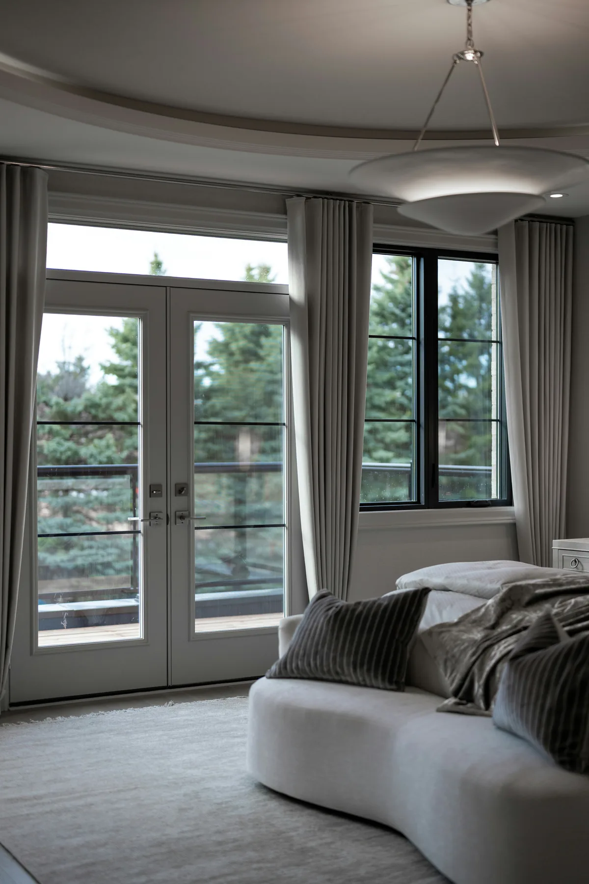 Quiet bedroom looking into a pine landscape